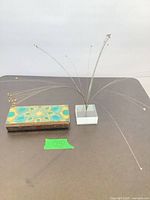 Box and acrylic wire spray shown together for scale and completeness