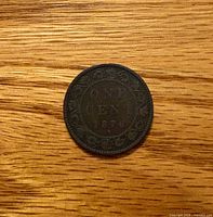 Reverse of 1876 Canadian large cent showing ONE CENT 1876 and vine border