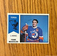 Front of the 1974-75 O-Pee-Chee WHA Frank Mahovlich card showing player image, team name, position and card number