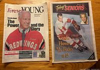 Front covers of both newspapers showing Gordie Howe images and headlines