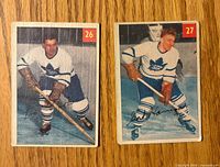 Fronts of cards showing Leo Boivin (#26) and Gordie Hannigan (#27)