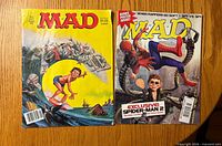 Front covers of both MAD magazines