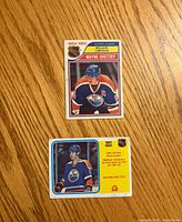 Fronts of both Wayne Gretzky scoring leader cards