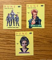 Fronts of three color Dune stickers