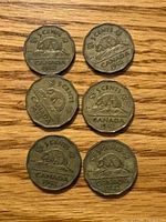Six 1942 Canadian 5-cent coins reverse side