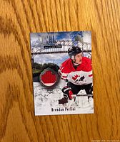 Front of Brendan Perlini jersey card showing red swatch and player image
