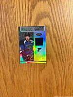 Front of Panini Certified Fabric of the Game jersey card showing jersey swatch and David Backes image