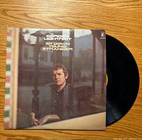 Front cover of Gordon Lightfoot album with record partially visible