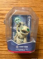Front view of Skylanders Trap Team Funny Bone figure in blister packaging