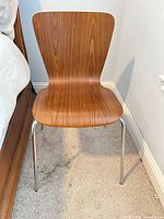 Front view of bentwood chair with wood veneer and chrome legs