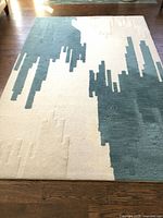 Full view of rug showing abstract pattern