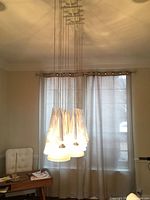 Full view of hanging Flos Fucsia 12 lamp in room setting