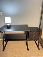 Front view of drafting table with side drawers