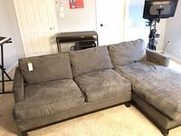 Front view of full sectional showing loveseat attached to chaise