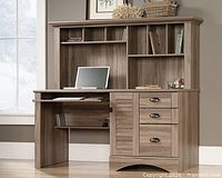 Stock image of assembled Sauder Harbor View computer desk with hutch