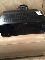 Front and top view of Yamaha RX-V665 receiver with antenna on top