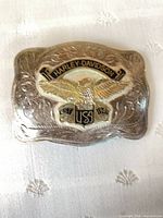 Front view showing eagle, USA shield, banner and scrollwork