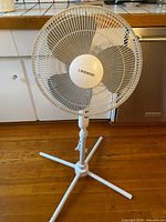 Full view of Likewise pedestal fan showing head, pole and three-leg base