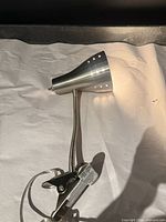 Full view of brushed nickel clip-on LED lamp showing shade, gooseneck, clamp and power cord