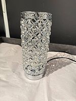 Full view of cylindrical chrome lattice lamp body