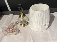 Lamp base, shade in packaging, and cord