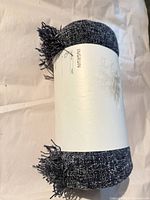 Rolled INGRUN throw blanket front label visible