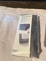 Front of sealed package showing NATTJASMIN name, size and product photo