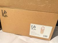 Factory box with Lib and Co. label and model details visible