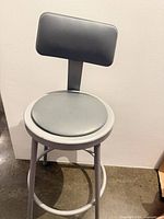 Full view of bar stool showing frame, seat, backrest, footrest