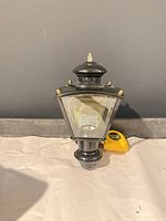Full view of black outdoor wall lantern sconce front