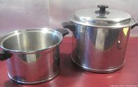 Both stainless steel pots side by side