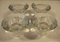 Top view of four clear glass candle holders