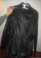 Full view of black leather coat front