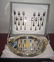 open presentation case showing tray and forks
