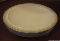 Top view of white dish showing gold rim
