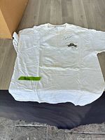 Full front view of autographed event T-shirt