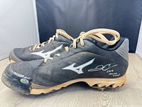 Side view of both cleats showing overall condition, Mizuno logos, laces, autographs
