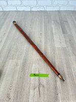 Entire walking stick showing length, handle and tip