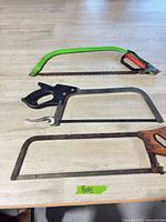 Three saws laid out on table