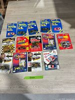 Group shot of all twelve blister-carded NASCAR diecast cars