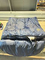 Sleeping bag folded on table