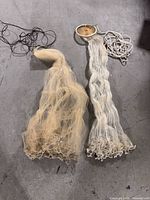 Both cast nets side by side showing size, color, hand lines and lead weights