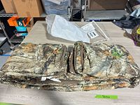 Folded Realtree Edge camo blanket on table