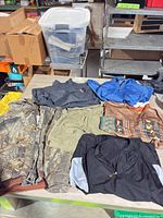 Overview of six garments laid on table