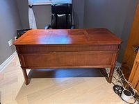 Front and top view of wood executive desk