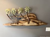 Front view of entire metal palm tree wall sculpture