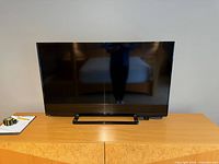 Front view of Toshiba 50-inch LED TV on stand