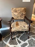 Front view showing overall design, wildlife upholstery and wooden frame