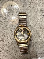 Full view of Crest wristwatch on countertop