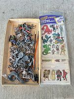 Tray of assorted miniatures, paint brushes, pin vise and sealed transfer sheet